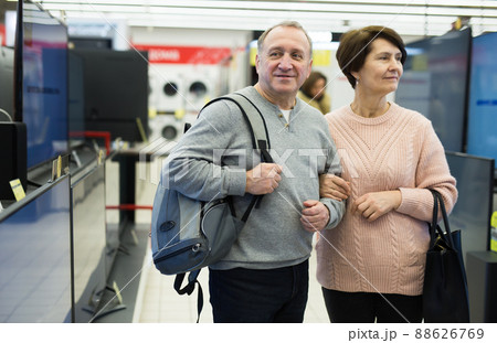 Mature man and woman shopping in appliance store 88626769