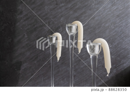 candlesticks in candlesticks melted from the sun or heat and went down 88628350