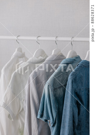 Closet, clothes hanging on hangers, stylish closet selection on a rail in the living room, Closet, clothes hanging on hangers, stylish closet selection on a rail in the living room, 88628371