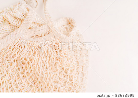 Eco Bags.A variety of eco bags on a yellow background . Sustainable lifestyle.Zero waste minimal composition with tring and canvas bags for storage.Zero waste, eco friendly shopping.Top view,flat lay. 88633999