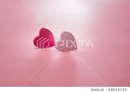 valentine's day, two hearts on a pink background.Two Hearts On Pink In Shiny Background - Valentine's Day Concept. valentine's day, two hearts on a pink background.Two Hearts On Pink In Shiny Background - Valentine's Day Concept. 88634143