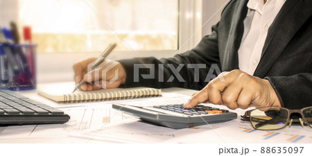 Businesswoman checking accounts and finances to calculate invoices in the office. Audit concept. 88635097