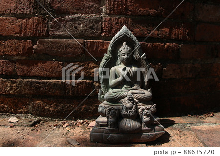 A Buddha statue and retro bricks wall, Thailand. 88635720