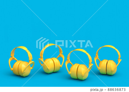 Set of protective yellow earphones muffs isolated on a blue background Set of protective yellow earphones muffs isolated on a blue background 88636873