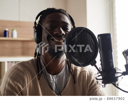 afroamerican male recording audio blog in headphones afroamerican male recording audio blog in headphones 88637902