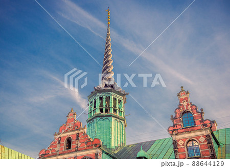 Tower with spire on the roof of the Old Stock Exchange Borsen Topped with four entwined dragon tails. Copenhagen, Denmark Tower with spire on the roof of the Old Stock Exchange Borsen Topped with four entwined dragon tails. Copenhagen, Denmark 88644129