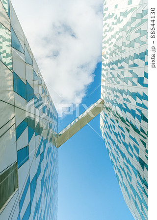 Transition block between two buildings of modern Bella Sky Comwell Hotel against the blue sky with clouds in orestad, Copenhagen, Denmark 88644130
