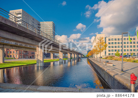 Canal with water on orestad boulevard in the city area orestad. On the bridge, metro subway line M1. Copenhagen , Denmark Canal with water on orestad boulevard in the city area orestad. On the bridge, metro subway line M1. Copenhagen , Denmark 88644178