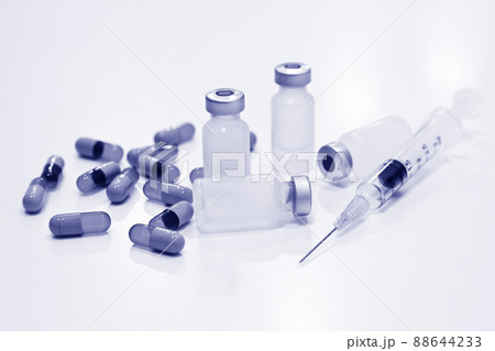 Vial of Drug, 3 ml Plastic Syringe with Needle and Drug Capsules Isolated on the White Background Vial of Drug, 3 ml Plastic Syringe with Needle and Drug Capsules Isolated on the White Background 88644233