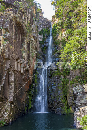 Beautiful waterfall called Veu da Noiva between moss covered rocks and the vegetation 88646074
