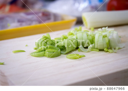 Sliced leek on a wooden cutting board Sliced leek on a wooden cutting board 88647966