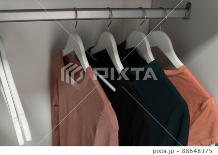 Fashion clothes hang on a hanger. Hangers with garment. Fashion clothes hang on a hanger. Hangers with garment. 88648375