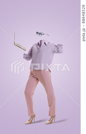 Portrait of invisible girl wearing modern business style pink outfit and eyeglasses using laptop on very peri color background. Concept of fashion, style 88648526