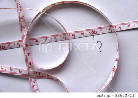 Sewing centimeter centimeter tape tailor's meter measuring tape on a white background Sewing centimeter centimeter tape tailor's meter measuring tape on a white background 88650711