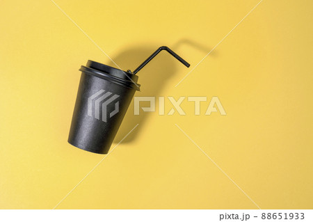 Coffee cup fly on yellow background. Coffee container mock up, blank space for logo. Coffee cup fly on yellow background. Coffee container mock up, blank space for logo. 88651933