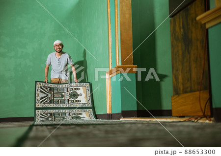 muslim young male cleaning the mosque before praying muslim young male cleaning the mosque before praying 88653300