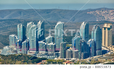 Istanbul, Turkey - April 3, 2017: Skyscrapers in the Maslak. Shooting through the glass. Retro style. Istanbul, Turkey - April 3, 2017: Skyscrapers in the Maslak. Shooting through the glass. Retro style. 88653873