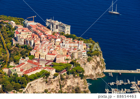 Aerial view of port Fontvieille at sunset, Oceanographic Museum of Monaco, South France, a lot of boats are moored in marina, view of city life from La Turbie mountain, mega yachts, luxury apartments Aerial view of port Fontvieille at sunset, Oceanographic Museum of Monaco, South France, a lot of boats are moored in marina, view of city life from La Turbie mountain, mega yachts, luxury apartments 88654463