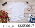 Womens white T-shirt mockup with blue sneakers 88656617