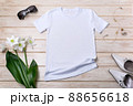 Womens white T-shirt mockup with lily flowers, green leaves 88656618