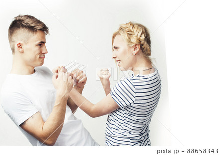 young pretty teenage couple, hipster guy with his girlfriend happy smiling and hugging isolated on white background, lifestyle people concept 88658343