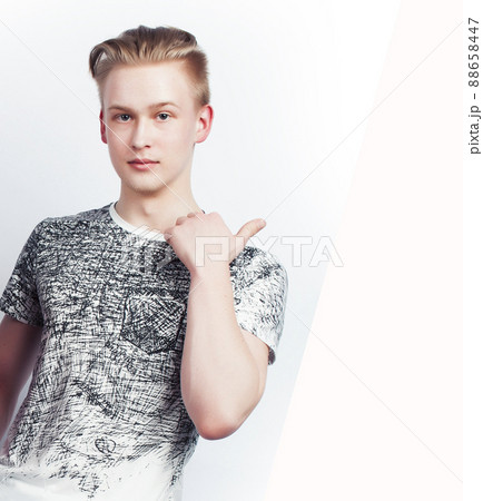 young handsome teenage hipster guy posing emotional, happy smiling against white background isolated, lifestyle people concept 88658447