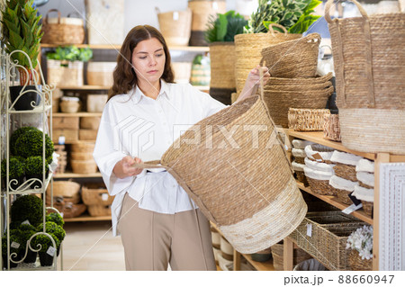 Woman choosing storage basket at household shop Woman choosing storage basket at household shop 88660947