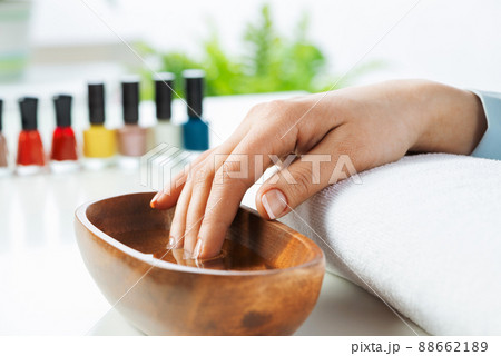 Closeup female hands in wooden bowl with water 88662189