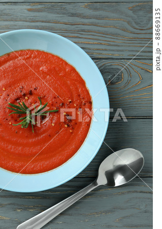 Concept of tasty eating with Gazpacho soup on gray wooden background Concept of tasty eating with Gazpacho soup on gray wooden background 88669135