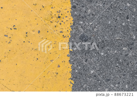 Asphalt street road markings with yellow paint abstract background design pattern Asphalt street road markings with yellow paint abstract background design pattern 88673221