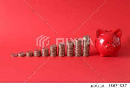 Pink piggy bank with money stack step up growing growth Pink piggy bank with money stack step up growing growth 88674327