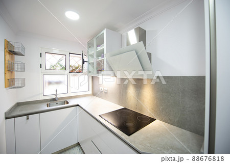 modern kitchen with all its appliances in a home modern kitchen with all its appliances in a home 88676818