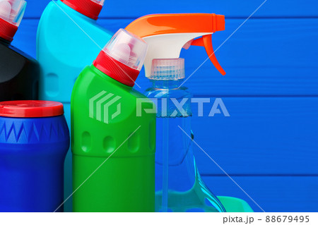 Various cleaning items against blue wooden background Various cleaning items against blue wooden background 88679495