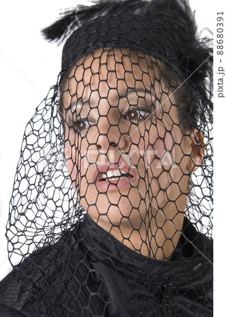 widowed woman dressed in black mourning her husband. widowed woman dressed in black mourning her husband. 88680391