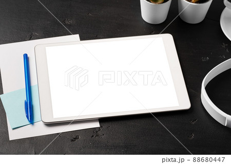 Minimal workplace with digital tablet and supplies 88680447