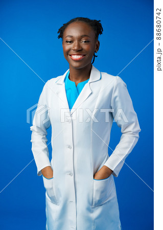 Portrait of young african female doctor in blue studio 88680742