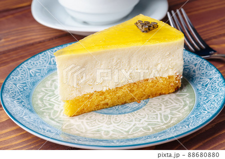 Lemon cheesecake on the plate close up Lemon cheesecake on the plate close up 88680880