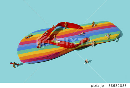 some miniature men on a rainbow flip-flop 88682083