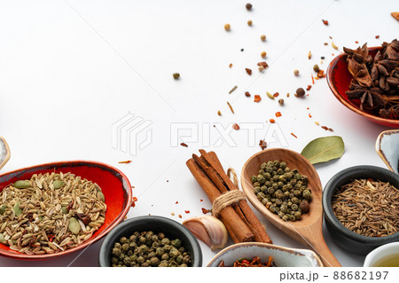Bowls with various spices on white background Bowls with various spices on white background 88682197