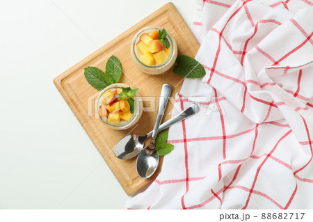 Concept of healthy food with peach yogurt on white background 88682717