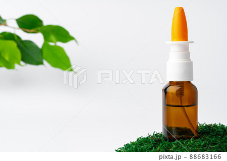 Cosmetics in a bottle, essential oil on moss 88683166