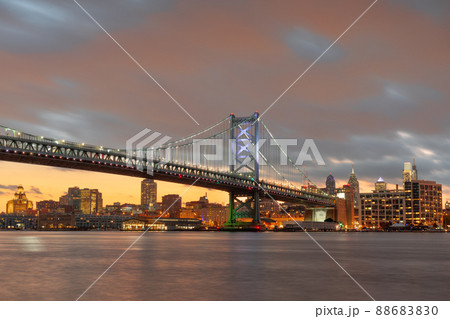 Philadelphia, Pennsylvania, USA skyline on the Delaware river with Ben Franklin Bridge Philadelphia, Pennsylvania, USA skyline on the Delaware river with Ben Franklin Bridge 88683830