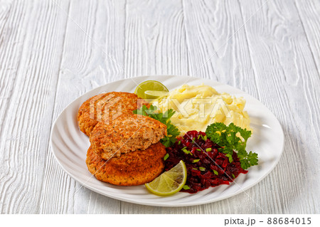 salmon patty with potato mash and beetroot salad 88684015