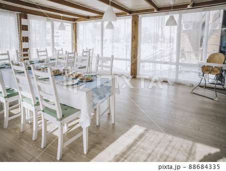 beautifully laid tables with glasses and appliances at morning in restaurant. Empty glasses 88684335