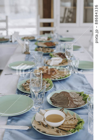 beautifully laid tables with glasses and appliances at morning in restaurant. Empty glasses 88684336