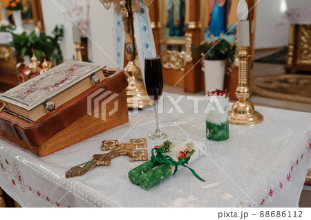 Traditional wedding crowns in the church. Wedding candles in the church ready for marriage 88686112