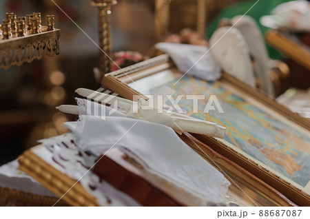 Wedding decoration in the church, candles, blurred background. Traditions Wedding decoration in the church, candles, blurred background. Traditions 88687087