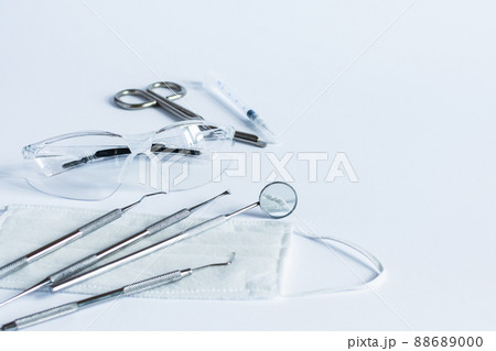 Doctor's dentistry tools for teeth dental care and treatment on white background. 88689000