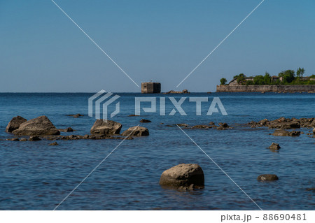 Russia. Kronstadt. May 30, 2021. The Reef Fort and Tolbukhin Lighthouse are on the horizon. 88690481