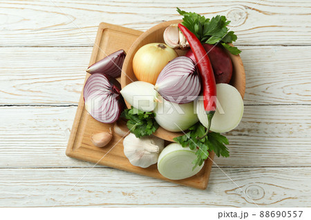Different spicy vegetables on white wooden background 88690557